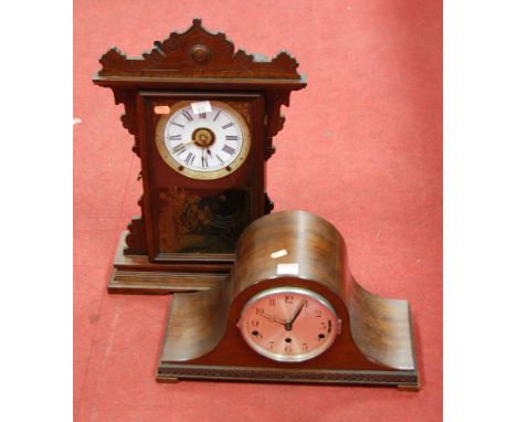 A late 19th century American stained pine cased mantel clock, having enamelled dial with Roman numerals, eight day movement s