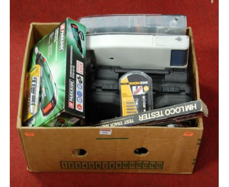 A box containing a quantity of modelling and model railway accessories and tools