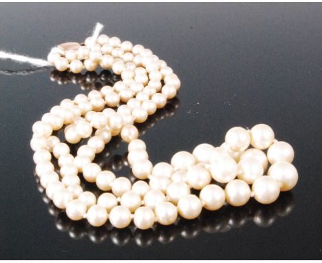 A simulated and graduated pearl double string choker with 9ct gold clasp