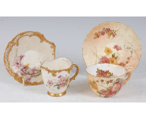 A Royal Worcester reticulated cabinet cup and saucer, on a white ground with painted floral decoration within gilt borders, p