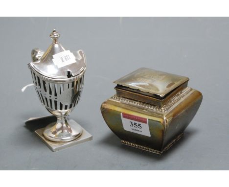 A small Edwardian silver tea caddy of plain undecorated bombe form