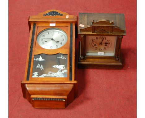 A late 19th century continental oak cased mantel clock, having a silvered dial with Arabic numerals and eight day movement st
