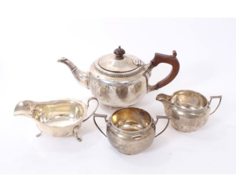 1920s silver three piece silver teaset comprising teapot, of bullet form, with ropework border, angular handle and hinged dom