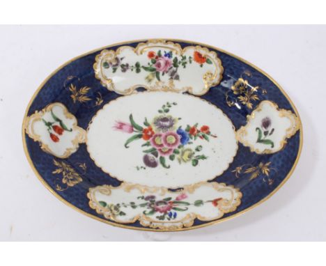 Worcester oval stand, circa 1770, painted with floral sprays on a blue scale ground with gilt highlights, pseudo-Chinese mark
