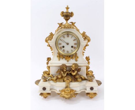 19th century mantel clock with French eight day movement and outside countwheel, striking on a bell, white marble dial with a