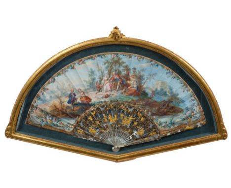 Fine quality 18th century French fan with painted pastoral landscape with courting figures in the manner of Boucher, carved a