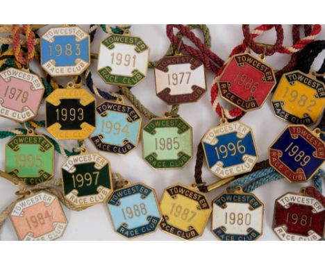 Collection of enamel racing badges for Towcester Race Club comprising: 1977, 1979-1989, 1991, 1993-1997 (18 items)