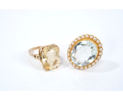 Edwardian aquamarine and seed pearl brooch converted to a ring, with a large oval mixed cut aquamarine in collet setting surr