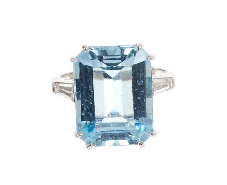 Aquamarine and diamond ring with a rectangular step cut aquamarine, estimated to weigh approximately 11.50cts, flanked by a t