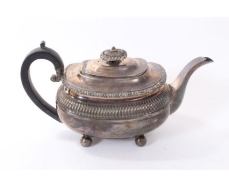 George III silver teapot of compressed baluster form, with fluted decoration and floral border, angular ebony handle and hing