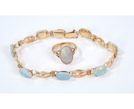 14ct gold and opal bracelet with seven opal cabochons measuring approximately 8.5mm x 11mm together with a 9ct gold opal sing