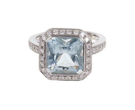 Aquamarine and diamond ring with a radiant step cut aquamarine, estimated to weigh approximately 4.14cts, surrounded by a bor
