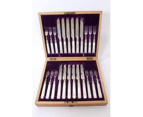 Late Victorian dessert service, comprising 12 pairs silver bladed knives and forks, with mother of pearl handles, in original