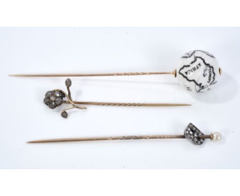 Three antique stick pins to include Victorian flower stick pin set with rose cut diamonds and seed pearl to the centre, Victo