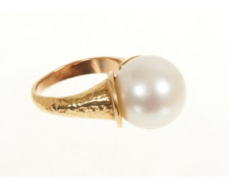 Cultured pearl ring with a large single cultured pearl measuring approximately 12.8mm diameter in gold setting of organic mod