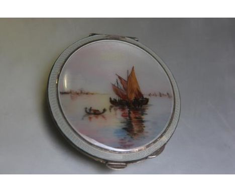 A Birmingham silver enamelled compact, the centre panel with view of Gondolas and Fishing Boats with Venice in the distance w