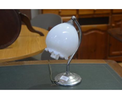 A 1930s chrome plated arched snowdrop style lamp with opaque glass shade and adjustable top, on circular stepped base (missin