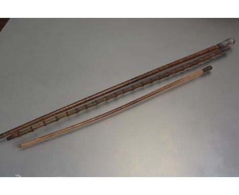 A walking cane with carved horn handle, a Royal Army Medical Corps mounted strutting cane, J Abrahams and a white metal mount