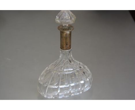 A crystal oval faceted cut decanter with white metal mounted stopper, stamped 800 (h.28cm)