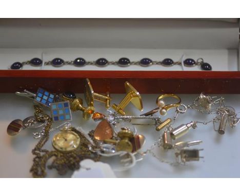 A Victorian yellow metal polished hardstone mounted stickpin, a fob watch, miscellaneous sleevelinks, a silver amethyst mount