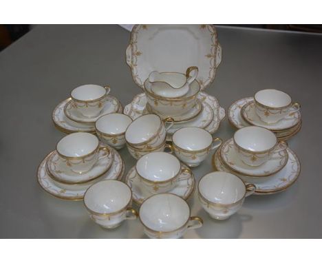 A Collingwood 1920s/30s forty piece yellow and gold enamelled Adam style tea service with enamelled decoration and gilded bor
