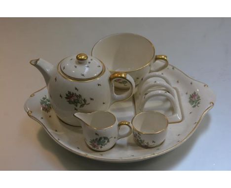 A Gray's Pottery breakfast cabaret set including cup, fitted saucer, toastrack, milk jug, sugar basin and teapot all with sty