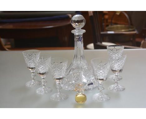 An Edinburgh Crystal ship's port decanter (h.29cm) and set of six crystal slice cut port glasses (h.13cm) (one with small chi
