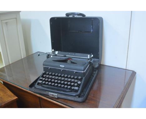 A Royal Quiet Deluxe portable typewriter with original case