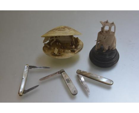 An Indian carved bone elephant, a Japanese early plastic clam shell with cottage, fishermen etc., a Victorian Glasgow silver 