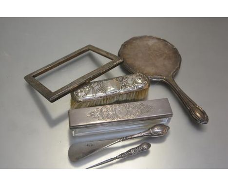 A Chester Art Nouveau style silver backed clothes brush with poppy and leaf decoration, a Birmingham silver photograph frame 