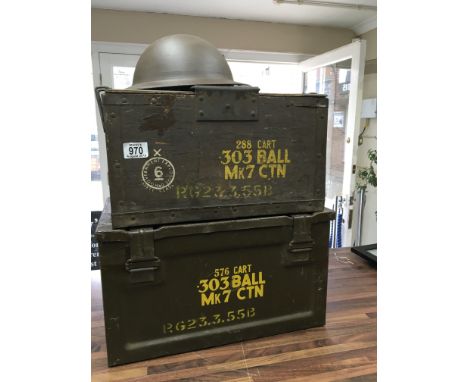 A collection of three ammunition boxes and together with WW 1 helmet 