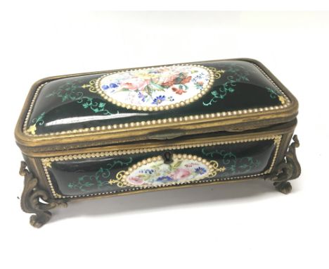 A French 19th Century enamel box of rectangular shape, decorated with ovals of flowers. 20x10cm.