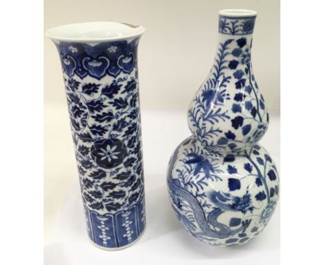 Two Chinese blue and blue vase comprising a double gourd, painted with a five claw dragon, 33cm, the other of cylindrical sha