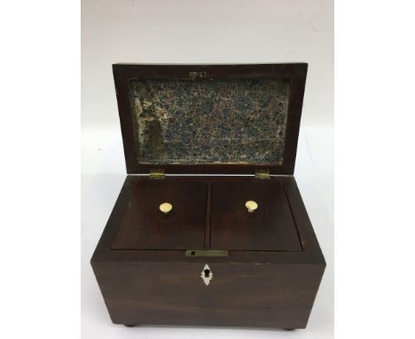 A mahogany tea caddy on bun feet.Approx 13x20x15cm high - NO RESERVE