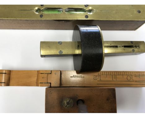 A small collection of working tools comprising sight level with brass top ends a mortise gauge screw tap by Moseley and son L