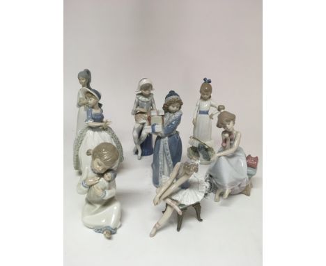 A collection of eight Spanish porcelain figurines including two Lladro and four Nao