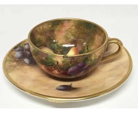 A Quality miniature hand painted Worcester cup and saucer the decoration with fruits on a rustic ground signed no damage or r