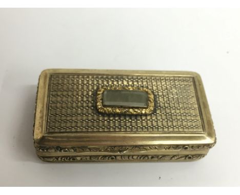 A fine Georgian, parcel gilt snuff box, the  turned lid set with cabouchon stone.Approx 3x6cm
