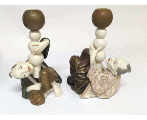 A rare and unusual pair of Worcester porcelain candle holders in the form of oriental figures Hight 18cm. No damage or restor