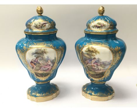 A pair of Quality 19th Century unmarked porcelain vase and covers of French Severs Style.decorated with Rocco style panels of