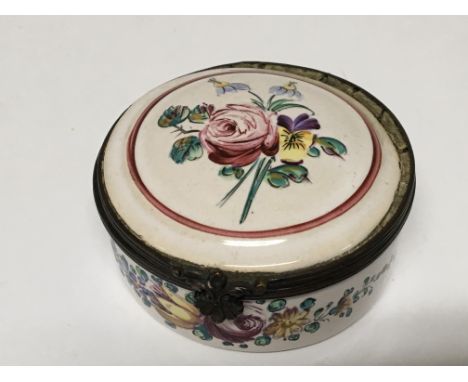 An Early 19th enamel box of circular shape with hand painted top and sides 6cm diameter. No damage.