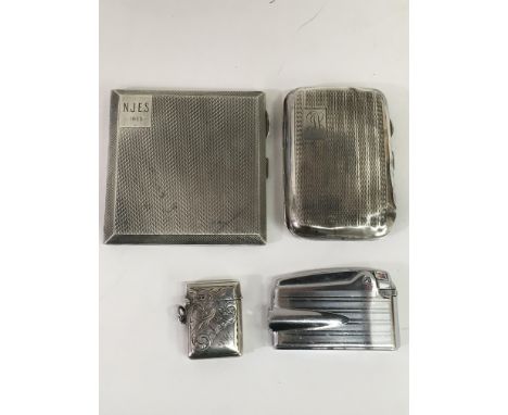 Two silver cigarette cases and a vesta, hallmarks for Chester and Birmingham and a lighter