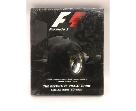 A sealed 'F1 The Definitive Visual Guide' hardback book with a limited edition numbered print signed by Lewis Hamilton - NO R