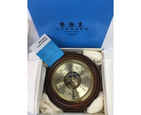 A boxed Garrard &amp; Co circular barometer.