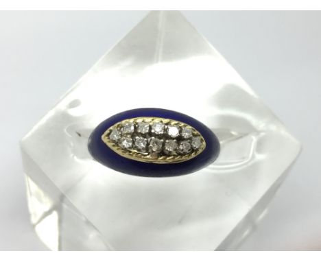 An unusual 18ct gold ring, having blue enamel mounted set with two rows of diamonds.Approx N, 5.9g, stamped 665