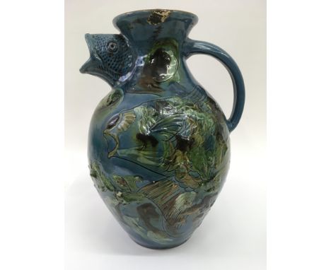A Branham fish head jug with incised decorated 32 cm Slight restoration to rim and light minor chips