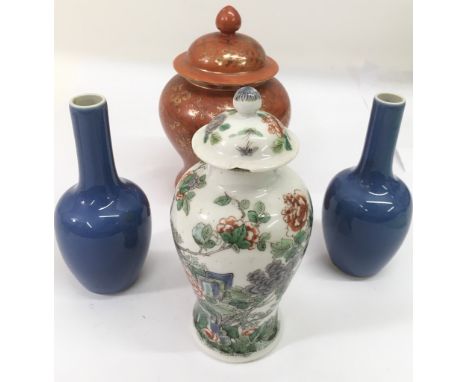 Four Chinese vases comprising a Famille Vert lidded vase painted with a garden, 17cm, a pair of long necked blue glaze exampl