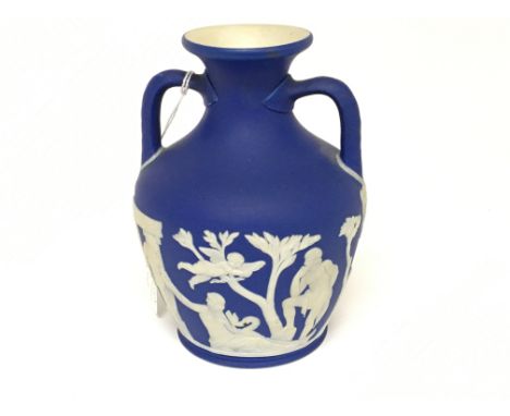 A  19th century Wedgwood model of the Portland vase with raised decoration height 15cm no damage or restoration marked to the