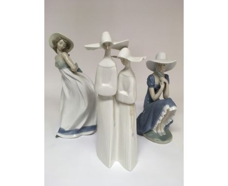 A Lladro figure of two nuns plus two Nao ladies. No damage or restoration