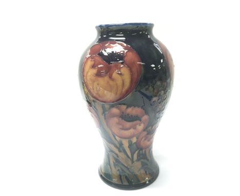 An Early William  Moorcroft big poppy pattern vase tube lined on a deep ground. Marks to the base height 23.5 no damage or re